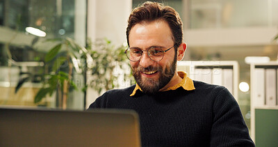 Buy stock photo Man, laptop and happy at startup, project and research for report, results and deadline at night. Person, editor and computer with smile, feedback or review process with overtime at creative agency