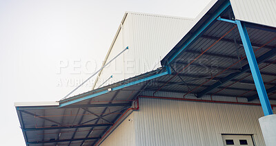 Buy stock photo Roof, warehouse and building with sky outdoor for commerce, dropshipping and storage. Below, industrial and property with exterior of logistics factory, courier business and structure of distribution