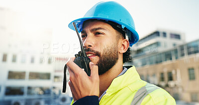 Buy stock photo Construction site, radio and man with engineering, feedback and inspection with quality control. Helmet, outdoor and person with architecture, conversation and property renovation with safety check