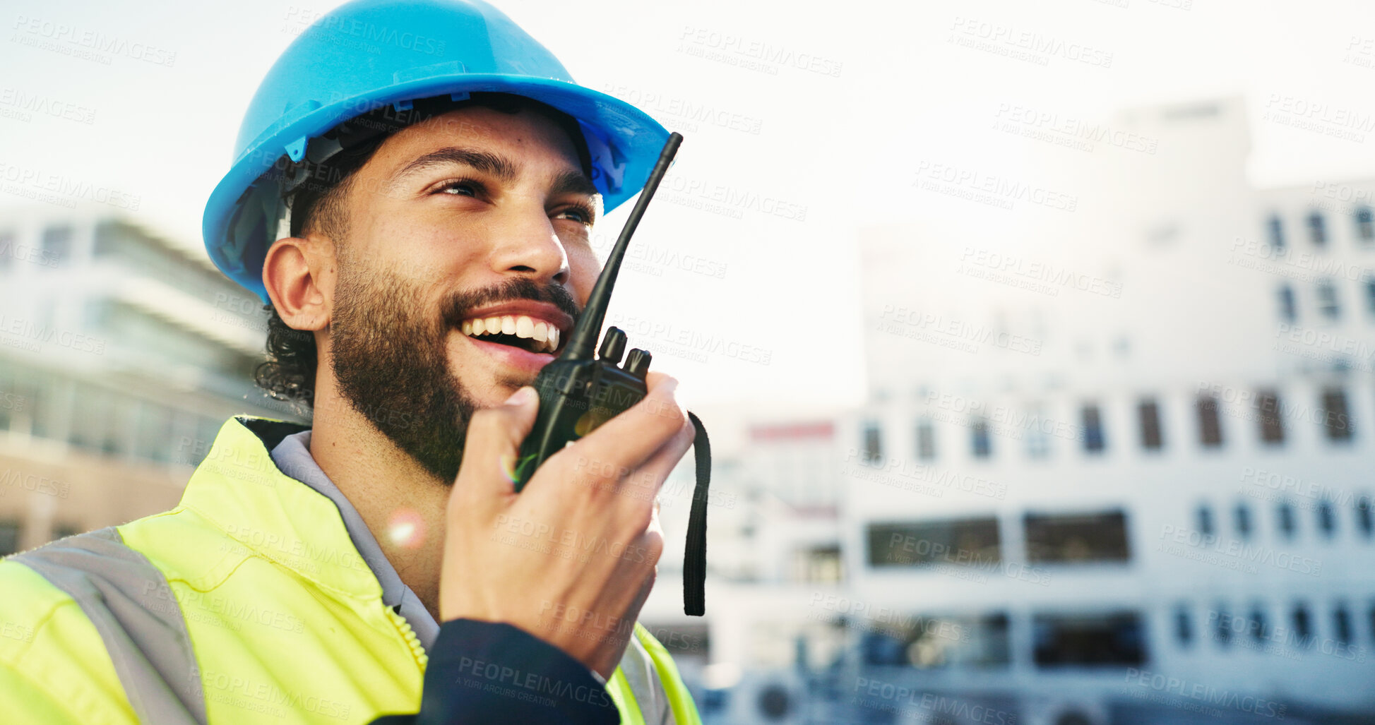 Buy stock photo Construction site, radio and man with engineering, smile and inspection with quality control. Helmet, feedback and person with architecture, conversation and property renovation with safety check