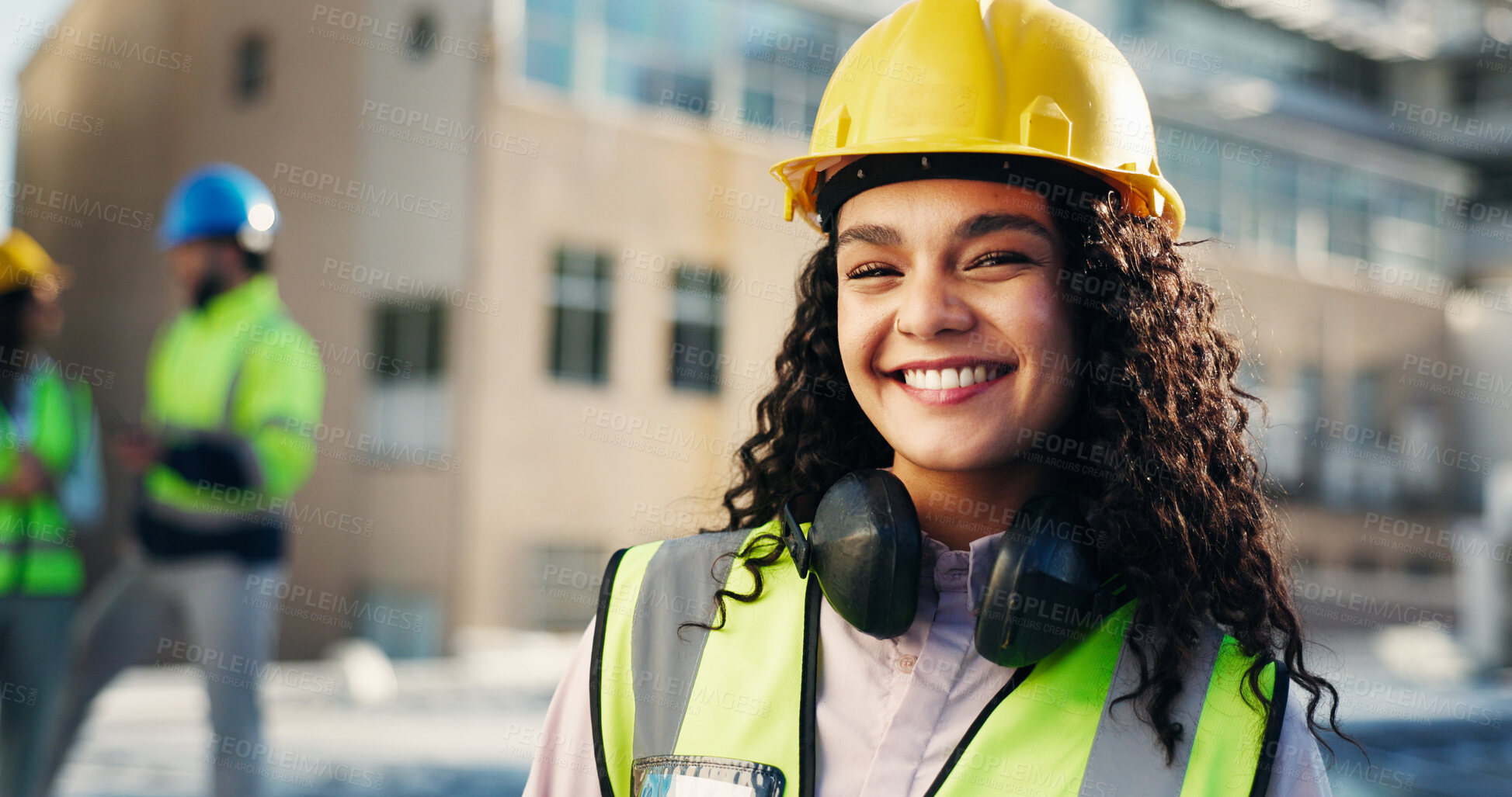 Buy stock photo Woman, smile and portrait at construction site for property development, safety for maintenance or renovation. Hardhat, headphones and protective gear with happy architect, contractor or engineering