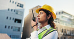Woman, engineer and talk on radio outdoor for discussion, planning and construction advice. Person, tech and conversation for architecture, building instructions and feedback for project management