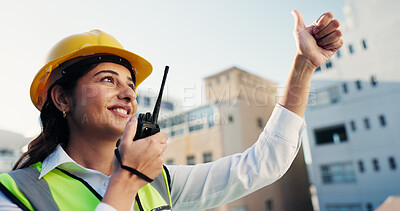 Buy stock photo Woman, construction site and radio with thumbs up for approval, communication and inspector outdoor in city. Engineer, gesture and manager speaking for building maintenance, success or architecture