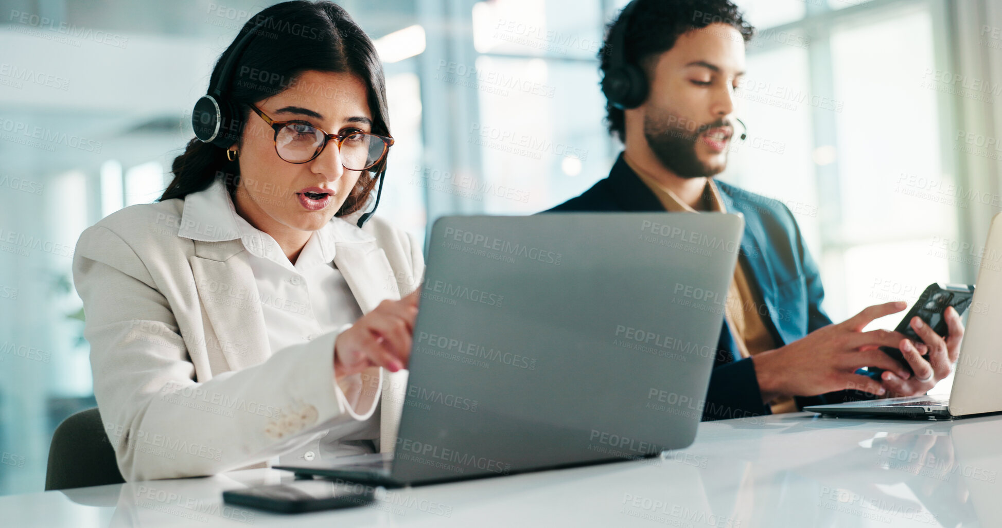 Buy stock photo Woman, contact center and laptop with headset for phone call, discussion and customer support with coworking. Female consultant, explain or online FAQ by pc with help desk employee and colleague 