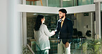 Business people, meeting and office with handshake for greeting, introduction or welcome. Businessman, woman or colleagues shaking hands with smile for hiring, recruiting or onboarding at workplace