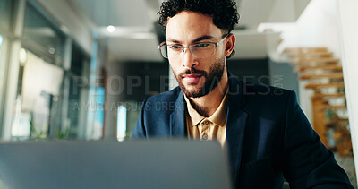 Buy stock photo Serious, employee and man with laptop, office or reading financial report on website or bookkeeping. Business, accountant and person with tech for investment, research and review of account info