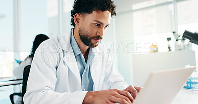 Buy stock photo Man, scientist and smile with laptop in lab for research, reading study and medical experiment. Male person, typing and online for project, biotechnology and science article of healthcare information