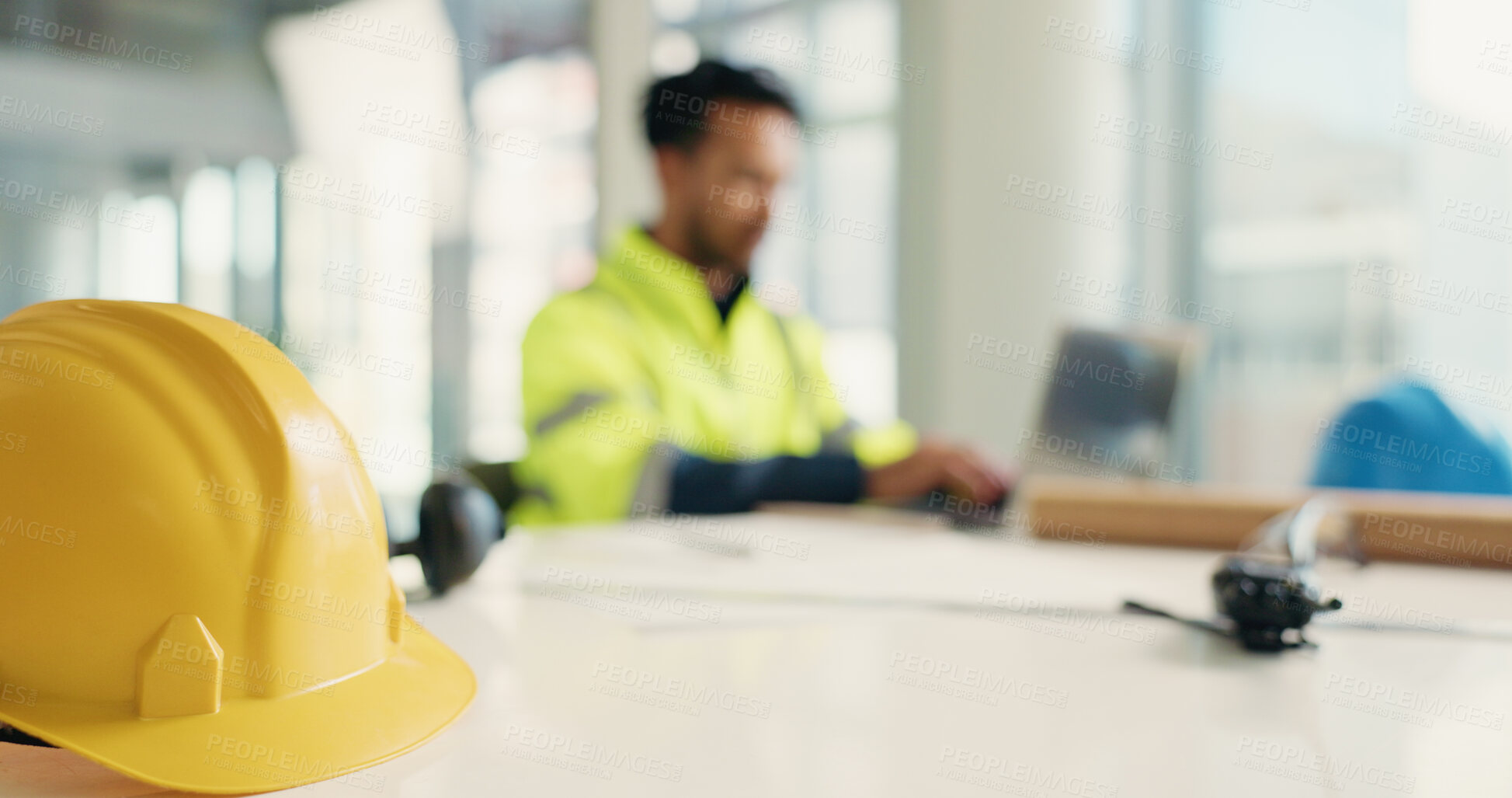 Buy stock photo Construction, helmet and man with equipment on table for site inspection, quality control or safety. Engineer, worker and laptop for industrial development, property renovation and project planning