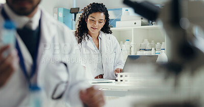 Buy stock photo Scientist, laptop and woman with tablet in lab for cancer research, test results or innovation. Science, experiment or biologist with coworker for medical study, vaccine development or clinical trial