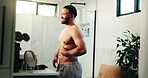 Happy man, belly and hygiene with weightloss in bathroom for personal care or confidence at home. Male person, body and topless smile with stomach fat in satisfaction for morning routine at house