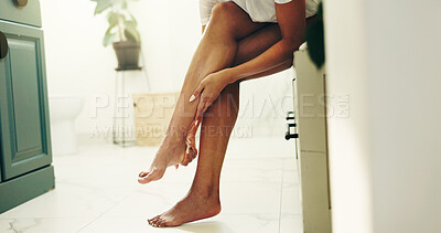 Buy stock photo Skincare, legs and woman with cream for beauty, glow and sunscreen for UV protection. Feet, cosmetics application and person with lotion for smooth skin, dermatology and moisturizer in home bathroom