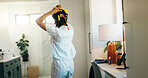 Hairstyle, curl and back of woman in bathroom for self care, grooming and salon treatment. Beauty, hair tools and diy routine with person and curling rods in home for cosmetics, glow and growth