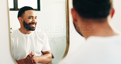 Buy stock photo Mirror, beauty and reflection with man in bathroom for skincare, grooming or cosmetics. Morning routine, dermatology progress and facial benefits with person in home for glow, treatment and hydration