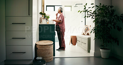 Buy stock photo Beauty, senior woman or face roller in bathroom mirror for anti aging, skincare routine or self care. Morning, person and jade stone tool in home for lymphatic drainage, skin elasticity and cosmetics