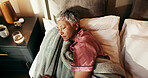 Senior, woman and sleeping above in bed for peaceful nap, rest or comfort in retirement at home. Top view, female person and relax with blanket or asleep in bedroom for break, holiday or weekend