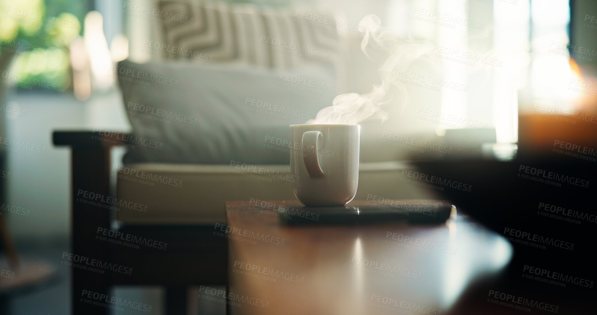 Buy stock photo Home, cup and coffee on table, steam and morning with hot beverage, lens flare and smoke. Empty, apartment and desk with mug, cappuccino and herbal tea with caffeine for improved cognitive function