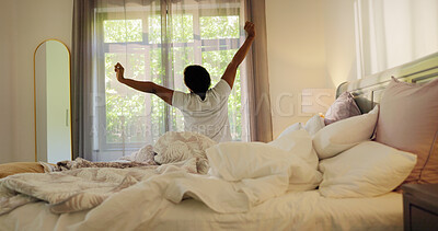 Buy stock photo Morning, back view and black woman in bed to stretch for health, wellness or resting routine in house. Pyjamas, relax and person waking up lazy in bedroom with comfort, new day and calm with peace