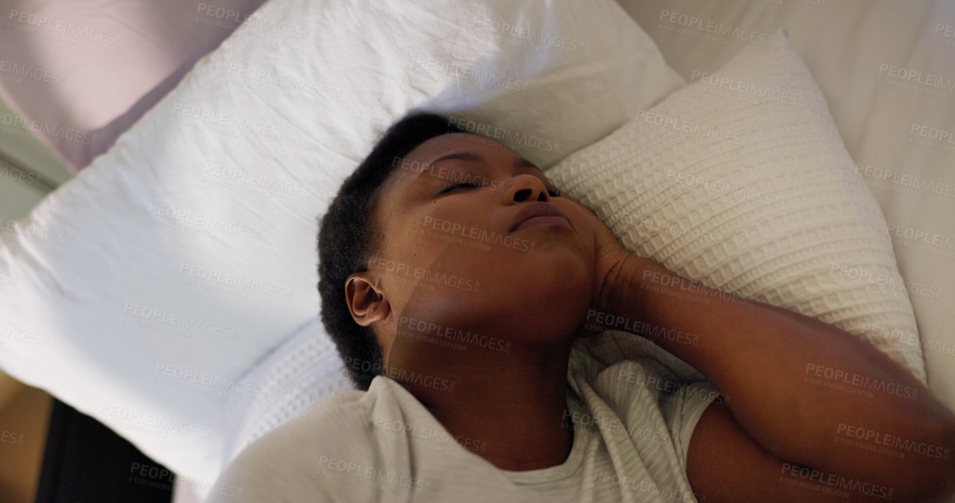 Buy stock photo Sleep, exhausted and black woman with dream in bed for resting, break and comfortable on pillow. Peace, wellness or tired female person in house bedroom for fatigue, morning nap and recovery to relax