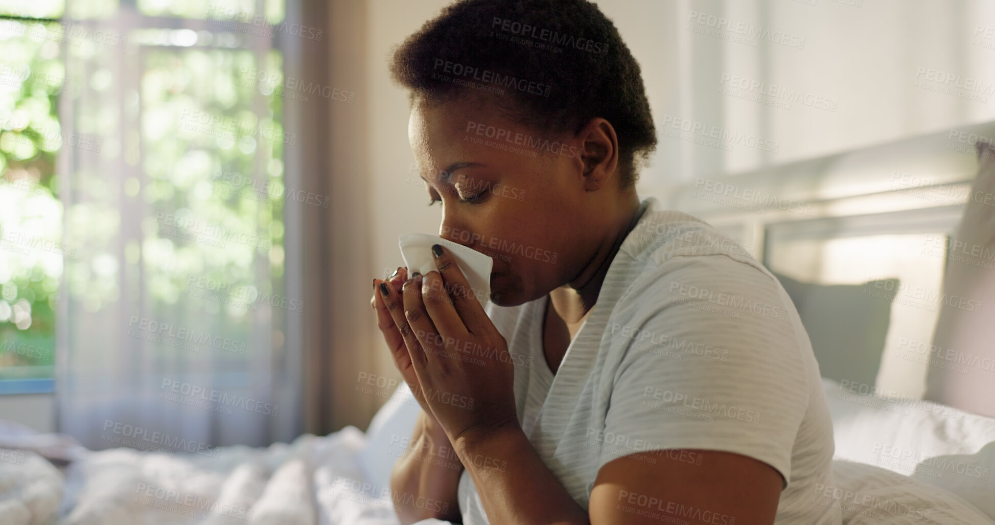 Buy stock photo Blowing nose, infection or black woman in bed with allergy, cold and flu in home with illness. Sick, virus or African female person with tissue paper for mucus, sneeze or fever with symptoms or germs
