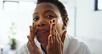 Bathroom, skincare and woman with cosmetics, routine and facial treatment for smooth skin or beauty. Home, black person and dermatology for soft face, moisturizer and self care in morning or grooming