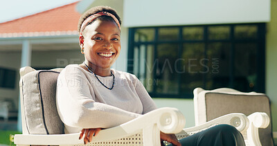 Buy stock photo Portrait, smile and black woman at backyard on chair for relax, chill and peace in morning by home. Happy African person, house and resting outdoor for calm, break and fresh air on weekend in Kenya