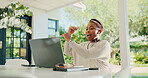 Black woman, earphones and talking with laptop for video call, discussion or online communication. Female person, conversation or chatting with computer for virtual explanation or remote proposal
