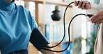 Blood pressure, pump and doctor with person in clinic for medical exam, checkup and consulting. Healthcare, hospital and patient with equipment to monitor for heart rate, wellness and hypertension