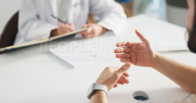 Buy stock photo Doctor, patient and hands at desk in consultation for diagnosis, help or healthcare at clinic visit. Client, talking and asking medical worker for health advice, results or prescription at hospital