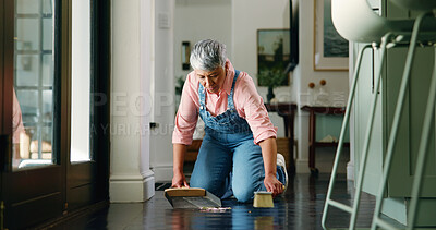 Buy stock photo Mature woman, scoop and cleaning floor in home for dirt removal, pickup trash and maintenance. Housekeeping, cleaner and sweeping in house to cleanup mess, hygiene and domestic chores for cleanliness