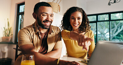 Buy stock photo Pointing, excited and couple with laptop, home and choice for hotel booking, travel website or tech. Happy, people and planning for trip in house, man and woman with smile for decision or online