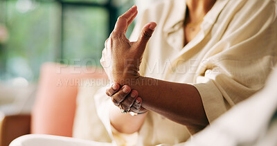 Buy stock photo Hands, arthritis and person with wrist pain on sofa for joint injury, inflammation and tension. Carpal tunnel, woman and sprain in home for osteoporosis and muscle fatigue from fibromyalgia disease