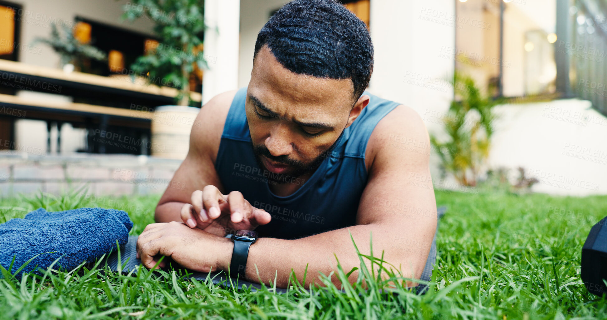 Buy stock photo Exercise, break and man with smart watch, outdoor or check heart rate on app, exhausted and fitness. House, lawn and person with timer for workout progress, tired and tech with stats for routine