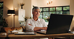 Senior woman, reading and laptop at house for application, budget and finance report at night. Elderly person, online and feedback for bank loan, retirement funding and deadline for expenses payment