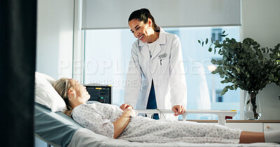 Buy stock photo Hospital bed, checkup and woman with doctor for healthcare with treatment planning. Discussion, medical consultation and female patient with surgeon for good news on diagnosis in clinical ward.