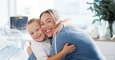 Buy stock photo Portrait, hug and kid in hospital, mother and smile with cure, wellness and happiness. Face, parent and family with mama, daughter or embrace with healthcare, recovery or medical service with support