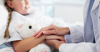 Buy stock photo Holding hands, doctor and child on bed in hospital for healthcare medicine, support and trust. Paediatrician, kid or patient with teddy bear at paediatrics clinic for help, empathy or comfort in ward