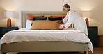 Woman, pillow and tidy bed in home for cleaning, morning habit and mattress care. Mature person, lumbar cushion and neat bedroom in apartment with daily routine, linen maintenance and housework