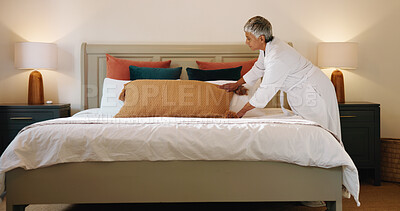Buy stock photo Woman, pillow and tidy bed in home for cleaning, morning habit and mattress care. Mature person, lumbar cushion and neat bedroom in apartment with daily routine, linen maintenance and housework