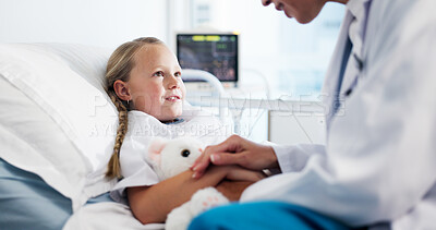 Buy stock photo Holding hands, doctor and child on bed in hospital for healthcare medicine, support and trust. Pediatrician, kid or patient with teddy bear at pediatrics clinic for help, empathy or comfort in ward