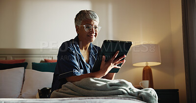 Buy stock photo Home, tablet and senior woman in bedroom, internet and online reading for news report. Pensioner, apartment and elderly person with tech, digital app and social media with email, relax and chatting