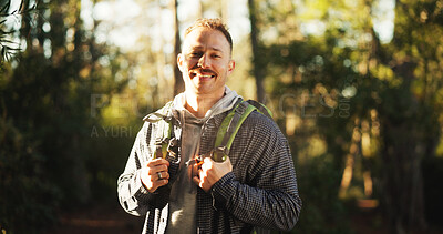 Buy stock photo Explore, hiking and portrait of man in nature for trekking, adventure and wilderness. Eco tourism, backpacking travel and journey with male person in forest for vacation, peace and wellness trip