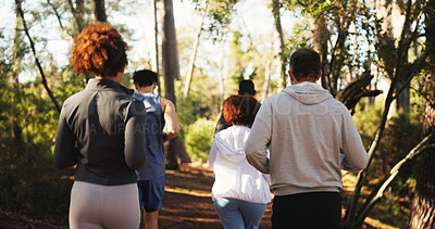 Buy stock photo Marathon, group and back in forest for fitness, workout and endurance for performance. Cardio club, running and jog together for competition, practice and team exercise for pace training challenge