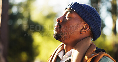 Buy stock photo Breathing, fresh air and man in nature, calm or hiker on vacation in woods, wellness or backpacking. Hiking, backpacker and black person in forest, peace and mindfulness on holiday and free time