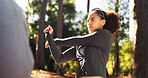 Woman, fitness and stretching with arms in forest for workout preparation or physical activity. Female person, runner or getting ready in warm up for outdoor exercise, hiking or trekking in nature