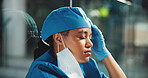 Tired, woman and healthcare with doctor in hospital for surgery error, patient death and depression. Medical malpractice, insurance liability and emergency with person in clinic for mistake and fear
