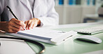Doctor, hands or writing with book for prescription, diagnosis or sick note at clinic desk. Nurse, healthcare worker or pen with letter for medical treatment or pharmaceutical script at hospital