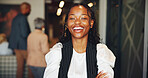 Business, laughing and portrait of black woman in lobby of convention center for conference. Arms crossed, development and tradeshow with happy employee waiting in foyer of workplace for seminar