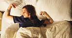Comfortable, rest and sleeping with woman in bedroom for morning or weekend break and wellness. Above, exhausted and tired with person asleep in bed of apartment for dreaming or recovery from fatigue