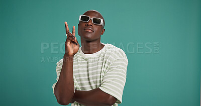 Buy stock photo Black man, fashion and sunglasses with confidence, style and peace sign on green studio background. Gen Z, male person or serious African model with accessory, shades or eyewear on mockup space