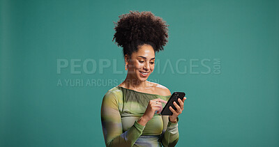 Buy stock photo Phone, smile and woman in studio for social media, text or reading fashion blog. Mobile, online chat and happy African model on app for news, check forum and play game on background with mockup space